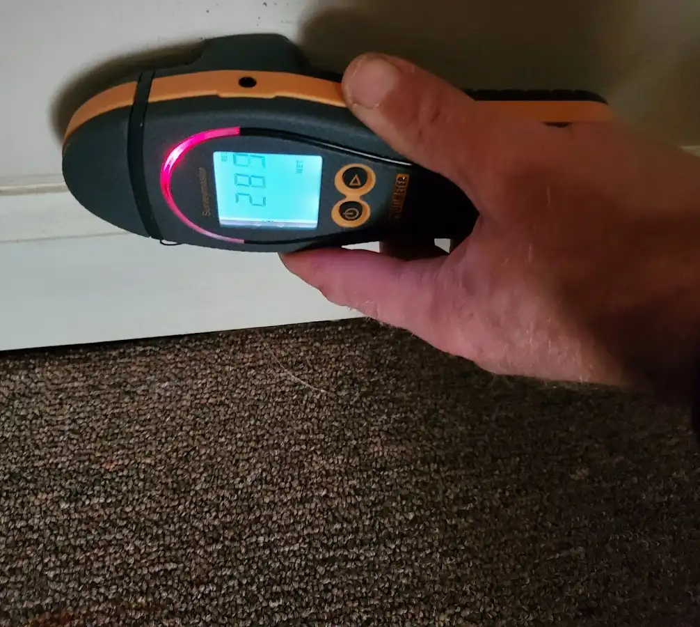 Moisture detection at baseboard during Storm Damage Restoration in Stone Ridge